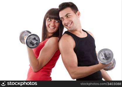Young man and a woman team training with dumbbells