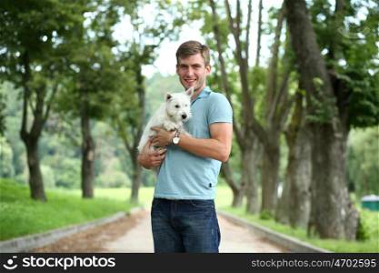 Young man and his adorable little dog