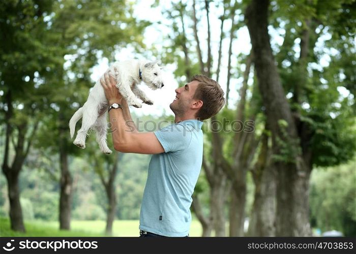 Young man and his adorable little dog