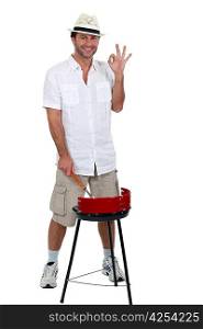 young man and his barbecue