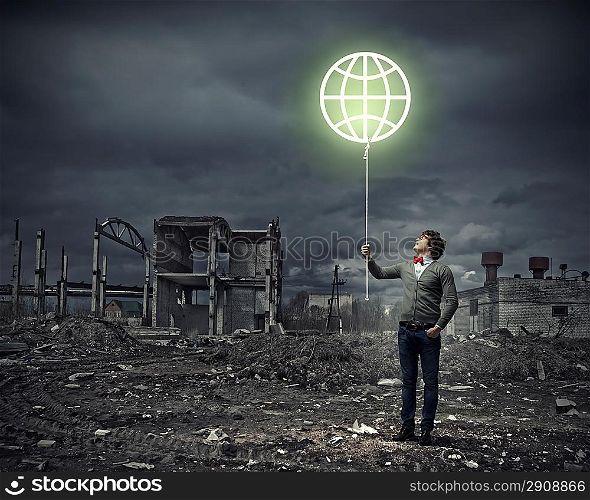 Young man and the symbol of our planet