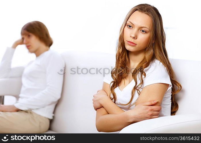 Young man and woman angry and conflicting