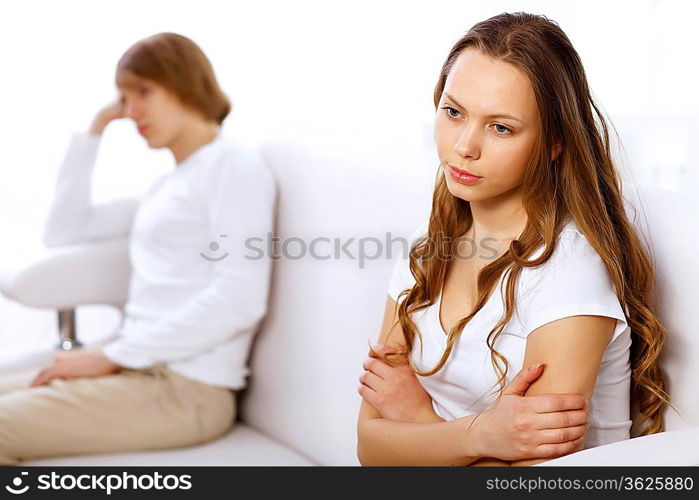 Young man and woman angry and conflicting