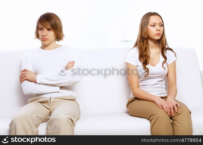 Young man and woman angry and conflicting