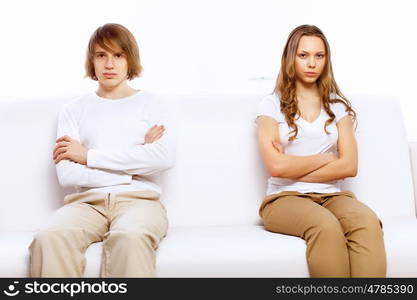 Young man and woman angry and conflicting