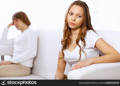 Young man and woman angry and conflicting