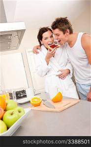 Young man and woman eating toast for breakfast