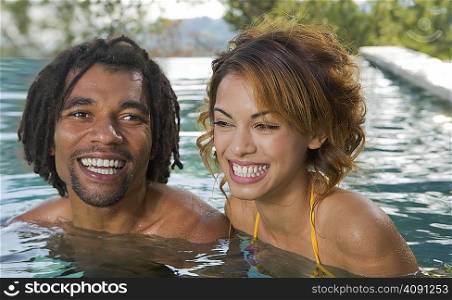 Young man and woman in a pool