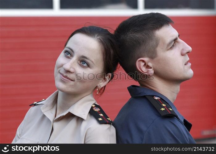 Young man and woman in ukrainian costume officers of the Ukrainian Ministry of Emergency Situations