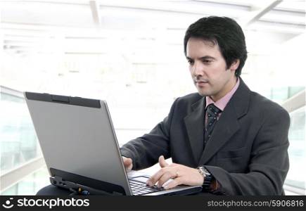 young man and working with is laptop