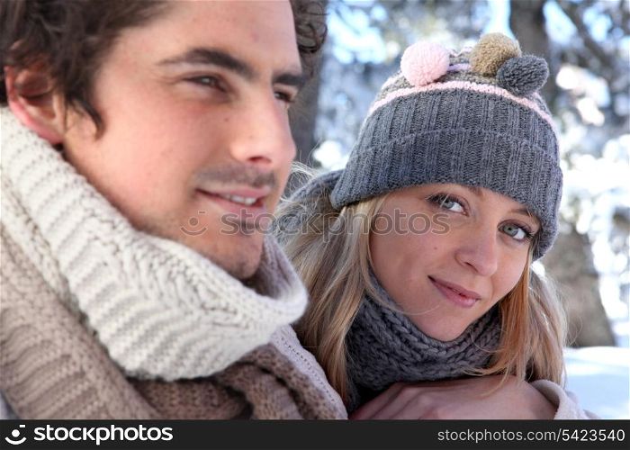 Young man and young woman wearing wool cap