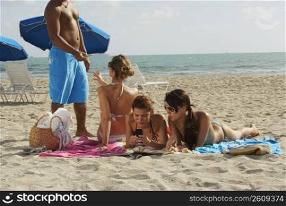 Young man and young women on beach