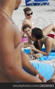 Young man and young women on beach