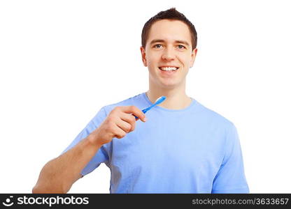 Young man at home brushing teeth in the morning