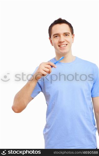 Young man at home brushing teeth in the morning