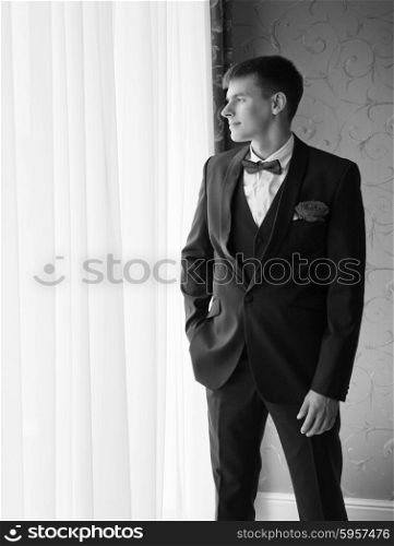 Young man at the window (monochrome)