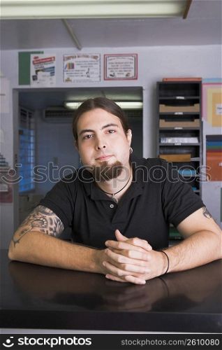 Young man at work in copy center