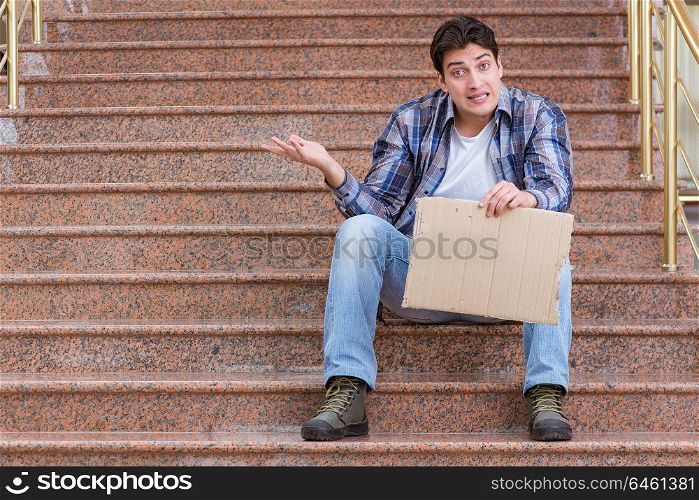 Young man begging money on the street