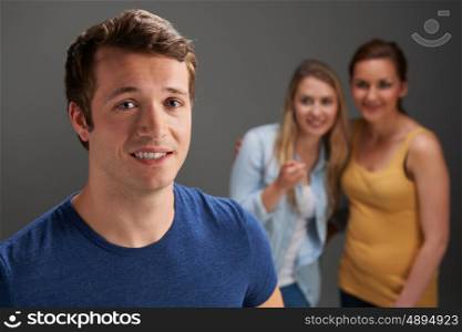Young Man Being Talked About By Women