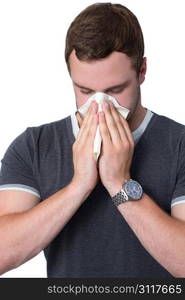 Young Man Blowing Nose into a tissue