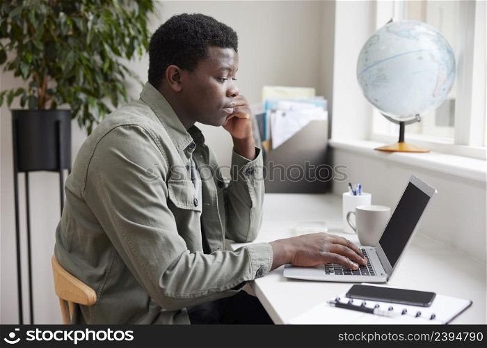 Young Man Business Entrepreneur Working From Home On Laptop
