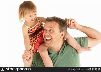 Young man carries child on shoulders