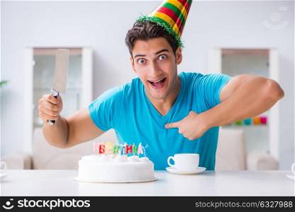 Young man celebrating birthday alone at home. The young man celebrating birthday alone at home