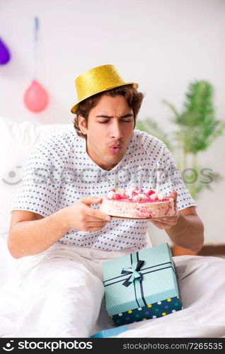 Young man celebrating his birthday in hospital