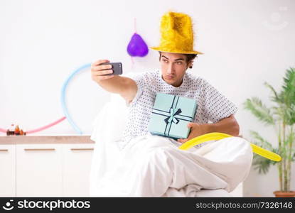 Young man celebrating his birthday in hospital