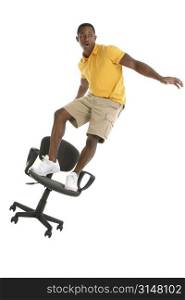Young man chair surfing.