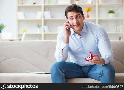 Young man chatting with his sweetheart over mobile phone