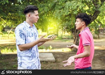 young man chatting with young man, two people arguing WITH COPY SPACE
