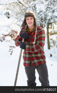 Young man clearing snow