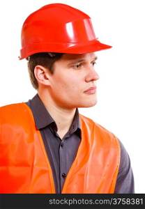 Young man construction worker builder foreman in orange safety vest and red hard hat isolated on white. Safety in industrial work. Studio shot.