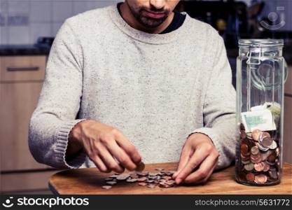 Young man counting his money