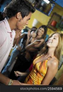 Young man dancing with a young woman