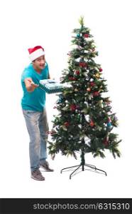 Young man decorating christmas tree isolated on white