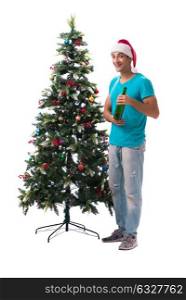 Young man decorating christmas tree isolated on white. The young man decorating christmas tree isolated on white