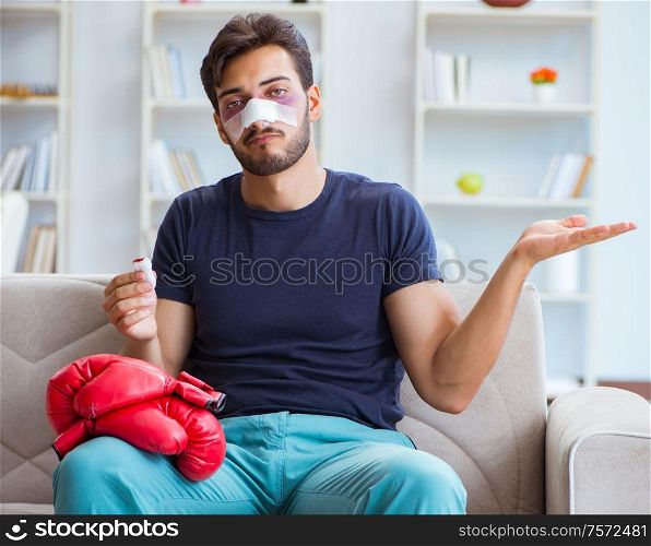 Young man defeated in sports game suffered loss with broken bleeding nose. Young man defeated in sports game suffered loss with broken blee