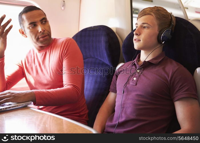 Young Man Disturbing Train Passengers With Loud Music