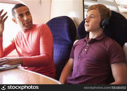 Young Man Disturbing Train Passengers With Loud Music