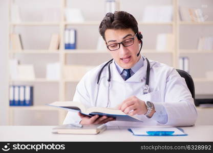 Young man doctor in medical concept