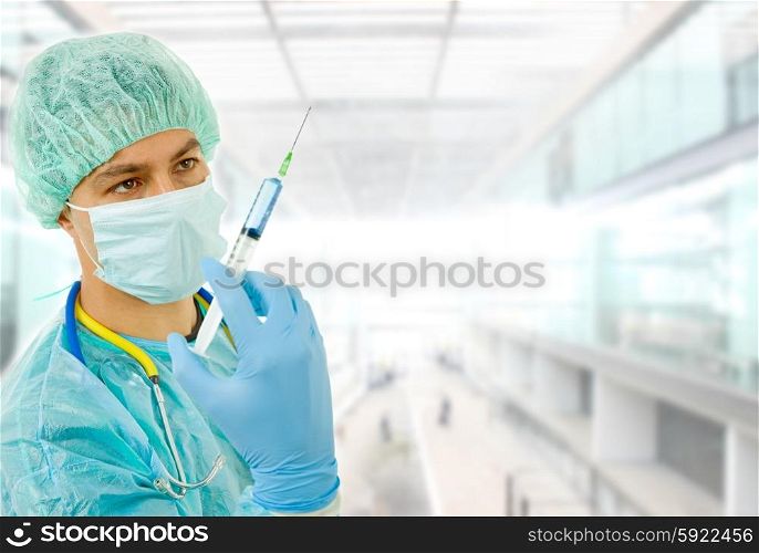 young man doctor portrait with a syringe