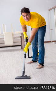 Young man doing chores at home