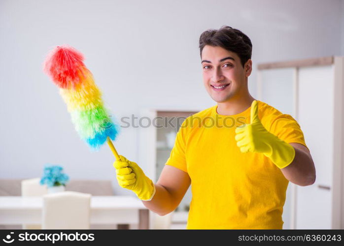 Young man doing chores at home