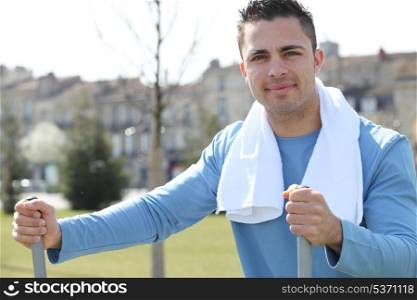 young man doing fitness outside