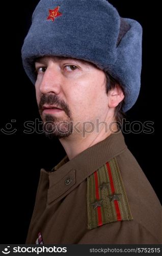 young man dressed as russian military, studio