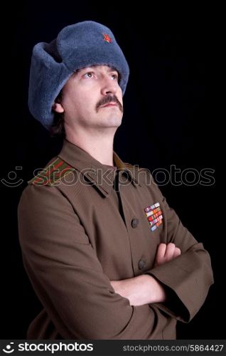 young man dressed as russian military, studio