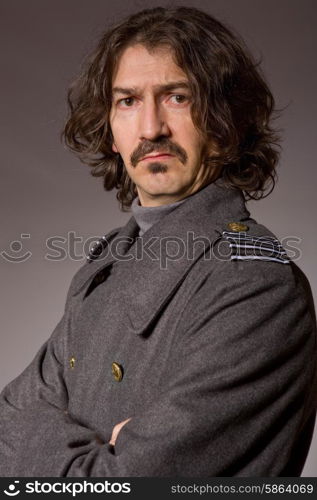 young man dressed as russian military, studio picture