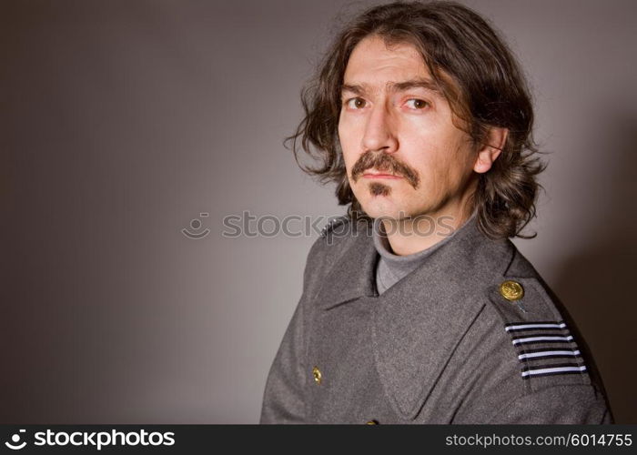 young man dressed as russian military, studio picture